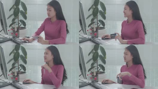 亚洲女性在家里用信用卡在电脑上购物高清在线视频素材下载