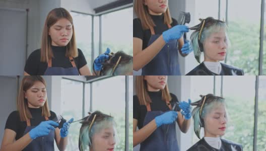 亚洲专业女性发型师或发型师染发年轻漂亮的女孩客户的头发。专业理发师在美容院为现代发型和发型提供护理和变色服务。高清在线视频素材下载