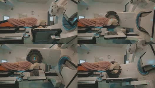 病人接受放射治疗在一个大放射治疗室内高清在线视频素材下载