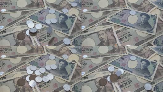 近距离观察日本硬币日元下跌的1000和10000日元纸币背景。超级慢动作120 fsp带声音。高清在线视频素材下载