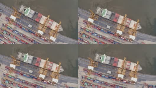 无人机在国际港口上空飞行的鸟瞰图高清在线视频素材下载
