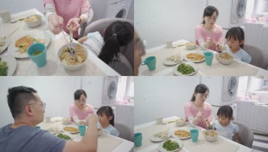 一个调皮的台湾小女孩在午餐时间玩高清在线视频素材下载