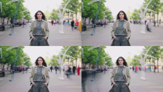 一个漂亮女孩站在街道上，双手插在口袋里看着相机高清在线视频素材下载
