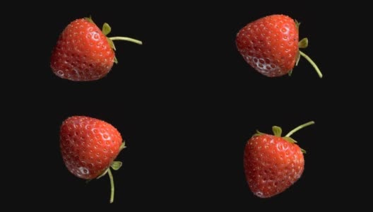 悬浮红草莓。旋转成熟的草莓在空中飞行孤立在黑色的背景。特写镜头，相机360度旋转。高清在线视频素材下载