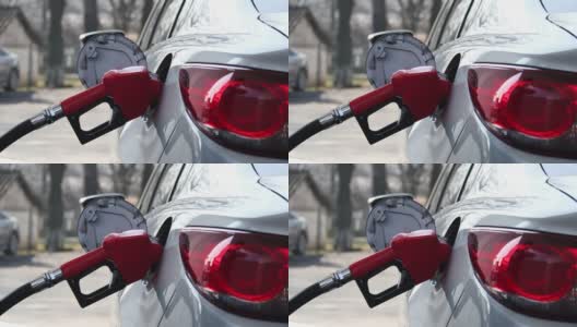特写的人填补汽油汽油燃料在汽车在加油站高清在线视频素材下载