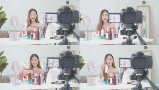 美丽的亚洲女人博客展示如何化妆和使用化妆品。在摄像机前录制在家的视频直播。商业在线影响者对社交媒体的概念。高清在线视频素材下载