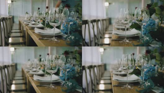 一个很酷很漂亮的节日桌子，上面有玻璃杯。桌子上还有其他的餐具高清在线视频素材下载