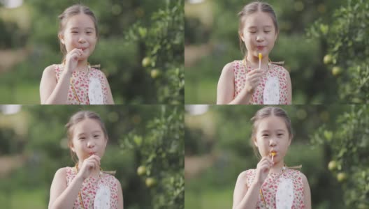 吃棒棒糖的快乐女孩高清在线视频素材下载