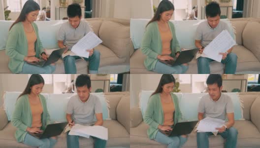 这是一对年轻夫妇在家里用笔记本电脑一起理财的4k视频高清在线视频素材下载