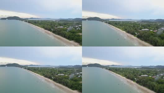 4K空中飞行在白色沙滩和美丽的蓝色海洋在泰国潮老海滩美丽的海景。高清在线视频素材下载