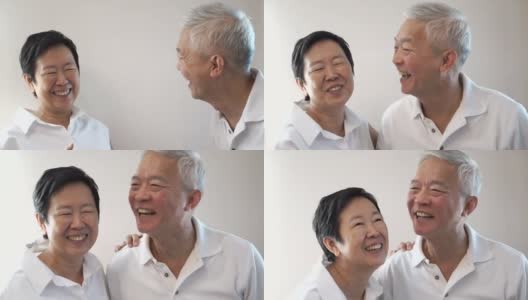 Happy Asian senior couple on white background. Laughing and talking高清在线视频素材下载