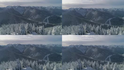 雪山山顶航拍带公路，为风景优美的自然之旅高清在线视频素材下载