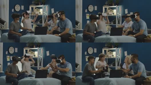 戴着VR眼镜的家人坐在床上高清在线视频素材下载