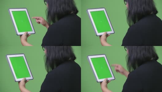 美丽的亚洲女商人使用数字平板电脑高清在线视频素材下载