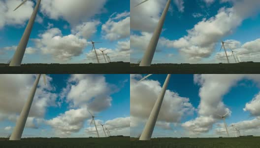在多云的日子里，用于农业领域发电的延时风力涡轮机。可再生能源、工农业概念。环保电力生产高清在线视频素材下载