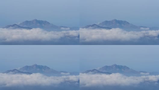 香港云海上空一座山的4K时间间隔高清在线视频素材下载