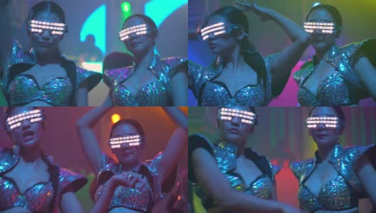 亚洲女性戴着led光眼镜在俱乐部跳舞高清在线视频素材下载