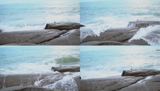 海浪拍打着海滩上的岩石。高清在线视频素材下载
