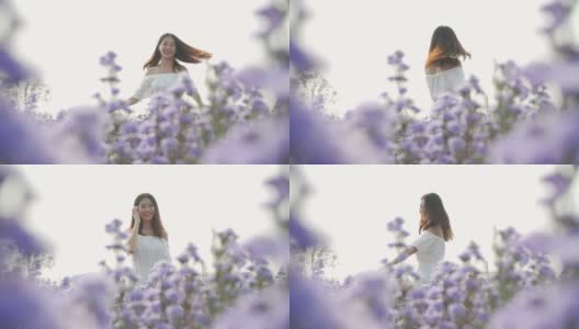 慢MO年轻女子跳舞在花的原野高清在线视频素材下载
