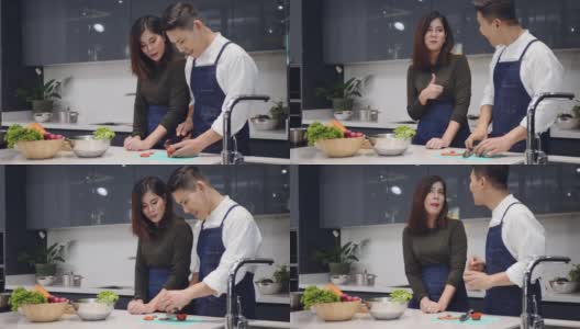 亚洲夫妇在厨房做饭高清在线视频素材下载