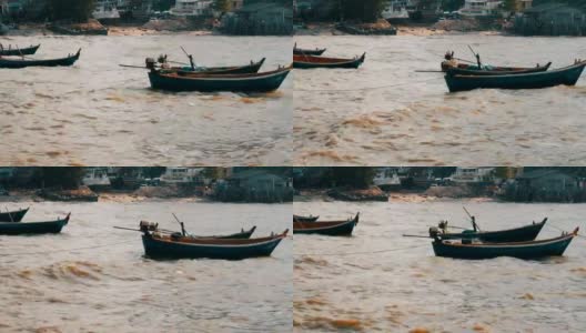 小渔船在波涛汹涌的海面上航行。渔民在海里捉鱼高清在线视频素材下载