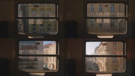 从运动中的火车窗口观看。旧城的都市化。阳光。高清在线视频素材下载