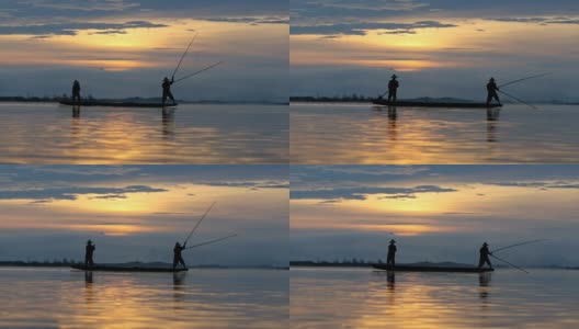 高清影像剪影两个身份不明的传统渔民准备在船上捕鱼高清在线视频素材下载