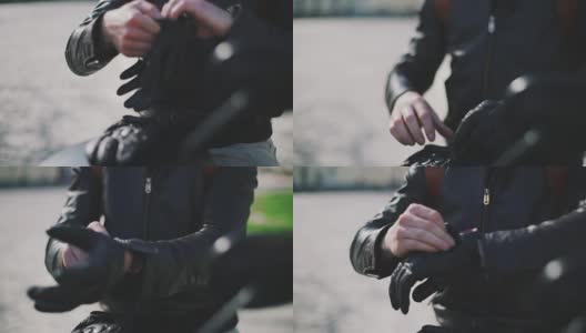 摩托车手戴上手套的特写高清在线视频素材下载
