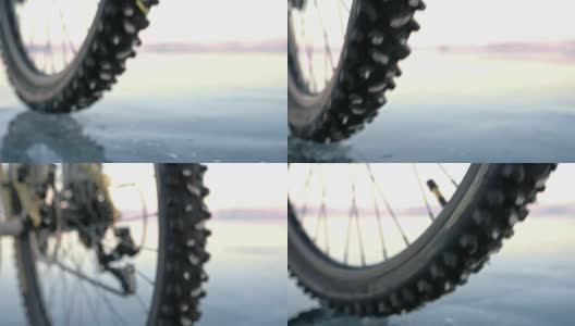 看轮胎。180 fps射击。一个女人在冰上骑自行车。结冰的贝加尔湖的冰。自行车的轮胎上覆盖着特殊的尖钉。高清在线视频素材下载