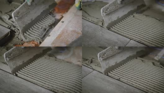 在用抹刀平整水泥的过程中，工头手里拿着一个工具，引导他们穿过水泥高清在线视频素材下载