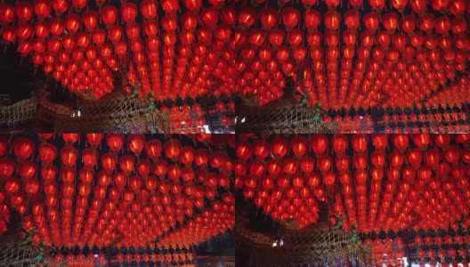 千盏中国红灯笼高清视频。点灯庆祝春节。台湾寺庙美丽的夜景高清在线视频素材下载