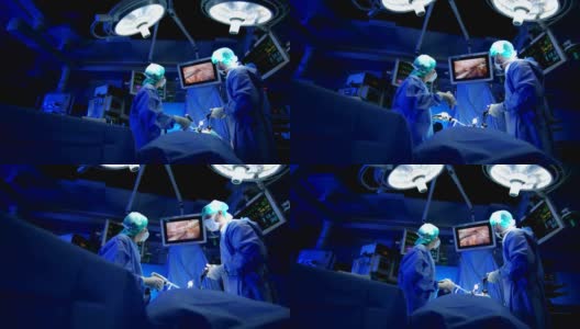 白种人医院训练小组准备进行腹腔镜手术高清在线视频素材下载