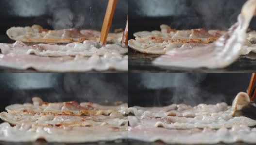 培根片用热蒸汽在煎锅里煎。高清在线视频素材下载