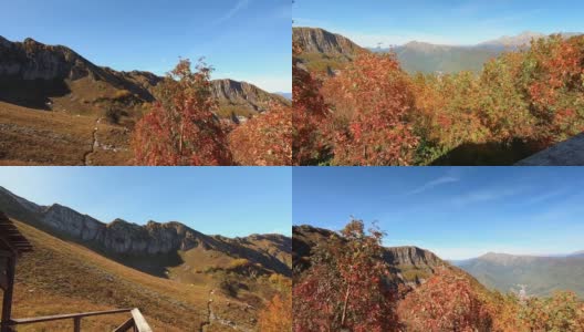 沿着山顶走。在明亮的蓝色天空的背景下，秋天五颜六色的全景山。在山中漫步高清在线视频素材下载