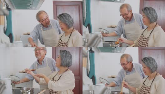 夫妇老亚洲长者幸福生活在家庭厨房。爷爷和奶奶一起煮沙拉菜，快乐地微笑着一起享受退休生活。老年人的关系和活动。高清在线视频素材下载