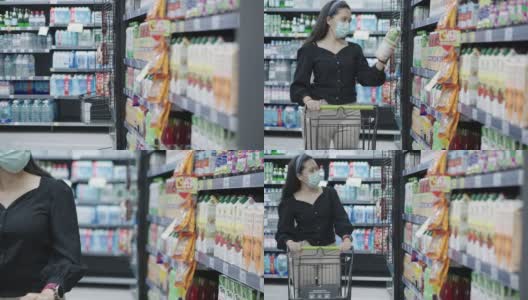 封锁后，亚洲中年妇女挑选和购买果汁时，在超市或商店购物和推着购物车时，戴着医用口罩，以防范冠状病毒疫情高清在线视频素材下载