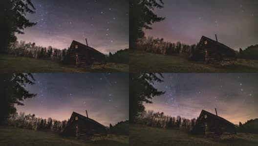 神奇的夜空与星星，银河系和云快速移动古老的木屋在野生喀尔巴阡自然天文时间推移4K高清在线视频素材下载