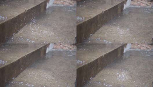 户外的雨点水滴落在路上高清在线视频素材下载