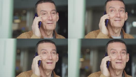 老人在机场用智能手机微笑着说话高清在线视频素材下载