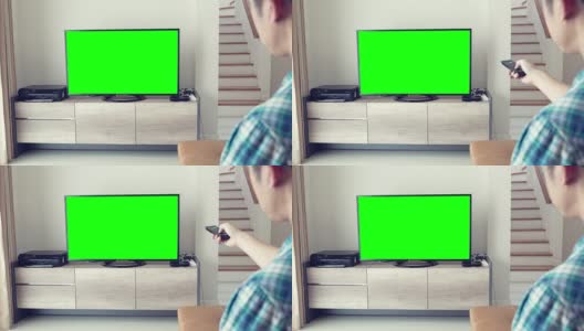 男人看绿屏幕电视高清在线视频素材下载