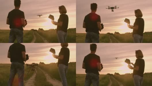 一对DS夫妇操控一架无人机降落在一条土路上高清在线视频素材下载