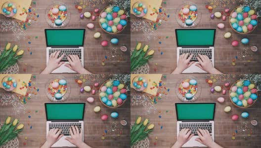 人用绿色屏幕的笔记本电脑在装饰复活节彩蛋的桌子上俯视图高清在线视频素材下载