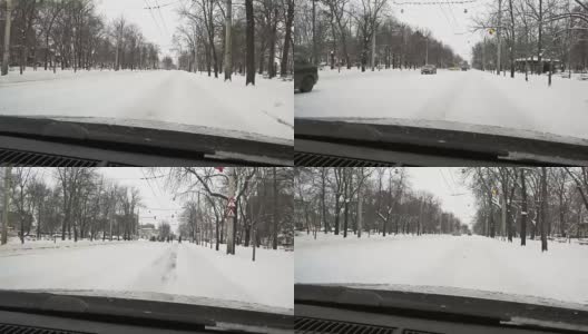 一场大雪过后，汽车载着雪行驶在城市道路上高清在线视频素材下载