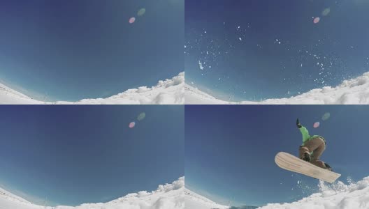 滑雪板在蓝天上跳跃高清在线视频素材下载