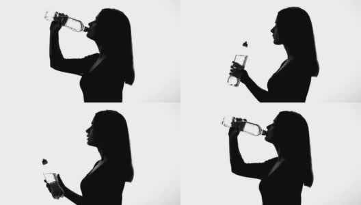喝瓶装水的女人，健康的生活方式，恢复ph值平衡高清在线视频素材下载