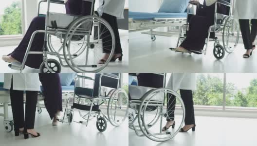 穆斯林妇女医生照顾穆斯林妇女。女医生用轮椅把病人送到床上高清在线视频素材下载