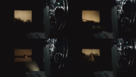 老式电影放映机在黑色胶片上拍摄高清在线视频素材下载