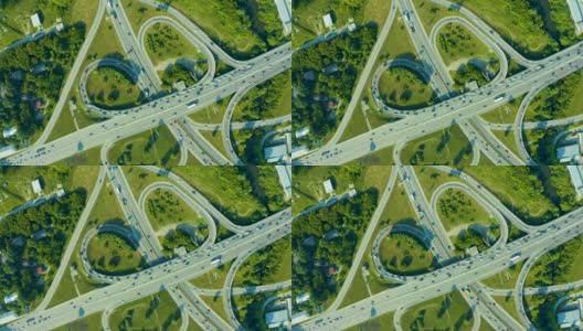 交通和基础设施:高速公路立交桥和汽车、卡车和公共汽车的交汇处。白天道路交通阻塞鸟瞰图高清在线视频素材下载