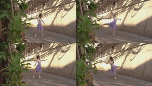 年轻美丽的芭蕾舞演员沿着街道跳舞高清在线视频素材下载