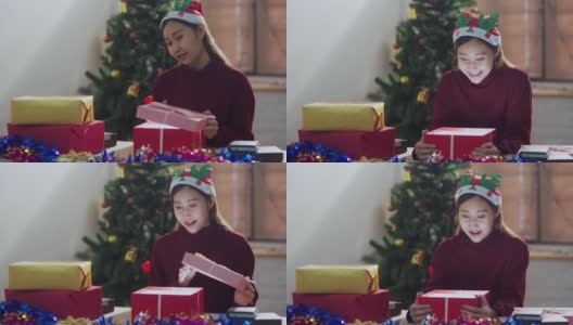 年轻女子打开和惊喜的圣诞礼盒高清在线视频素材下载